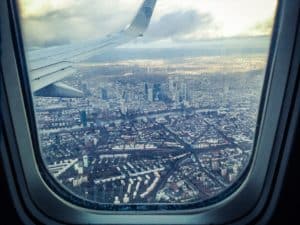 View out of an airplane window of a city