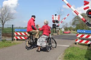 Elderly couple on bikes